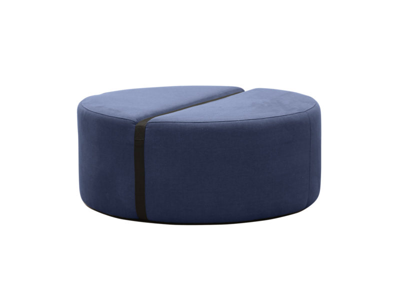 Round footstool in softly navy color.