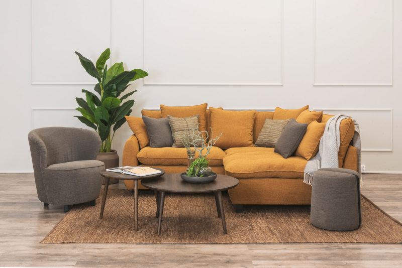 Chelsea sofa group in raymond winter sun color furnished with accessories.